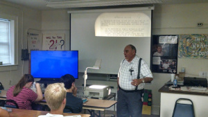 Mr. Sabbadino shows the class some material on the overhead projector.