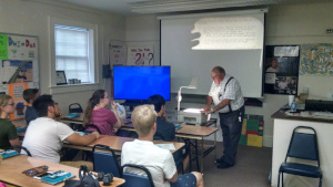 Mr. Sabbadino shows the class some material on the overhead projector.