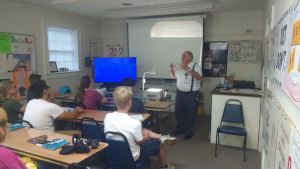 Mr. Sabbadino shows the class some material on the overhead projector.