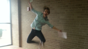 A former student jumps for joy because she just got her license!