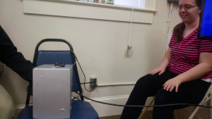 Students test their reflexes on a machine that simulates pressing the brake pedal in a car.