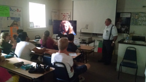Mr. Sabbadino shows the class a video.