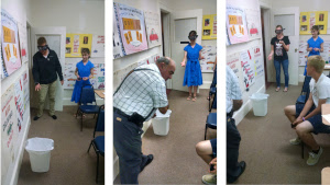 Students wear drunk goggles and try to toss a ball into a bucket.